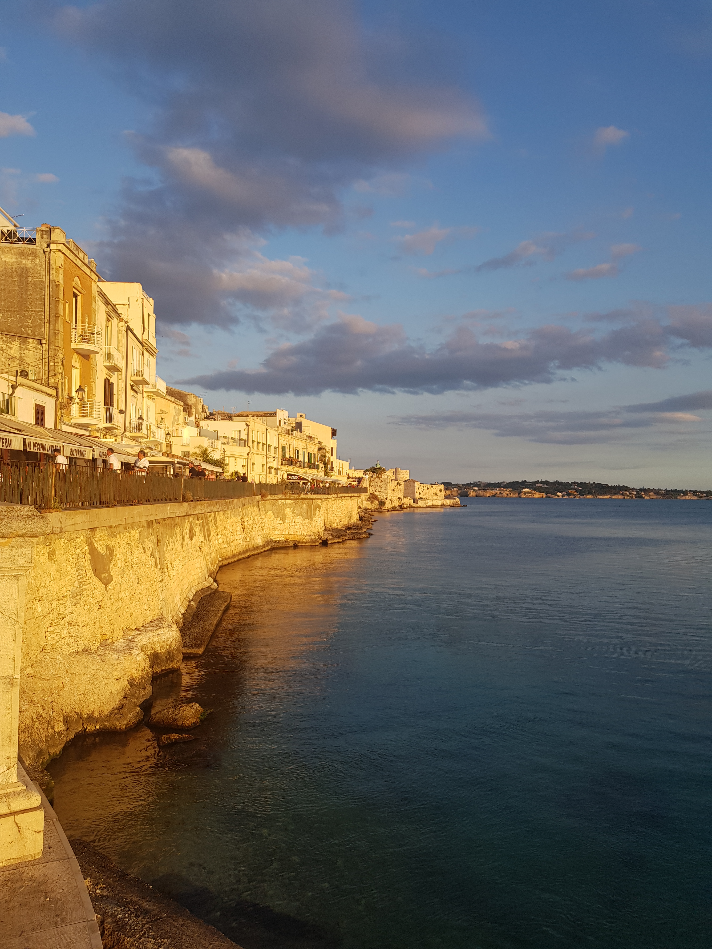 Sunset over Ortigia Island, Syrakus, Sicily - scenic spot for digital nomads Italy.