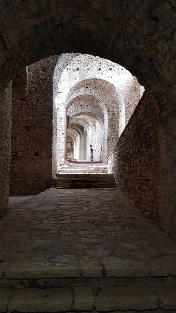 Historic arched walkway in Gjirokaster, a UNESCO World Heritage site often explored by digital nomads.
