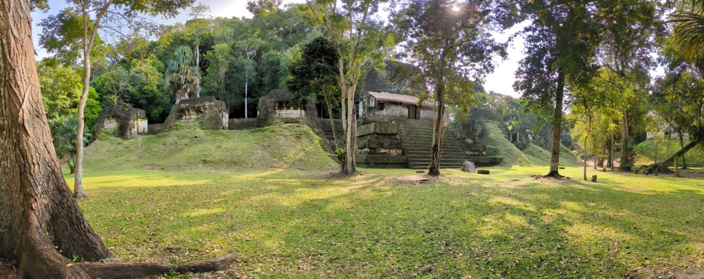 Ancient Mayan ruins nestled in the jungle at Yaxha, a lesser-known site for digital nomads exploring Guatemala.