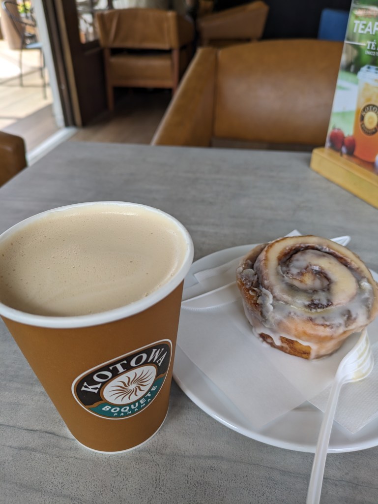 Coffee and cinnamon roll at Kotowa Coffee, a popular spot for Digital Nomads in Boquete, Panama