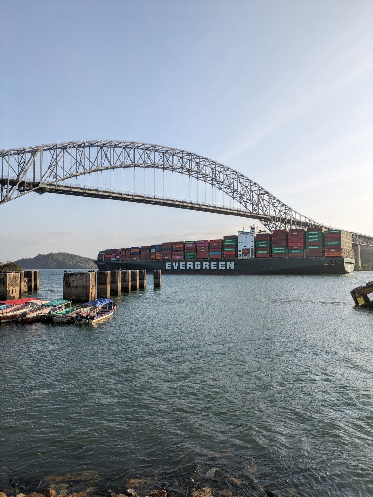 Bridge of the Americas with a passing container ship, an iconic view for Digital Nomads in Panama