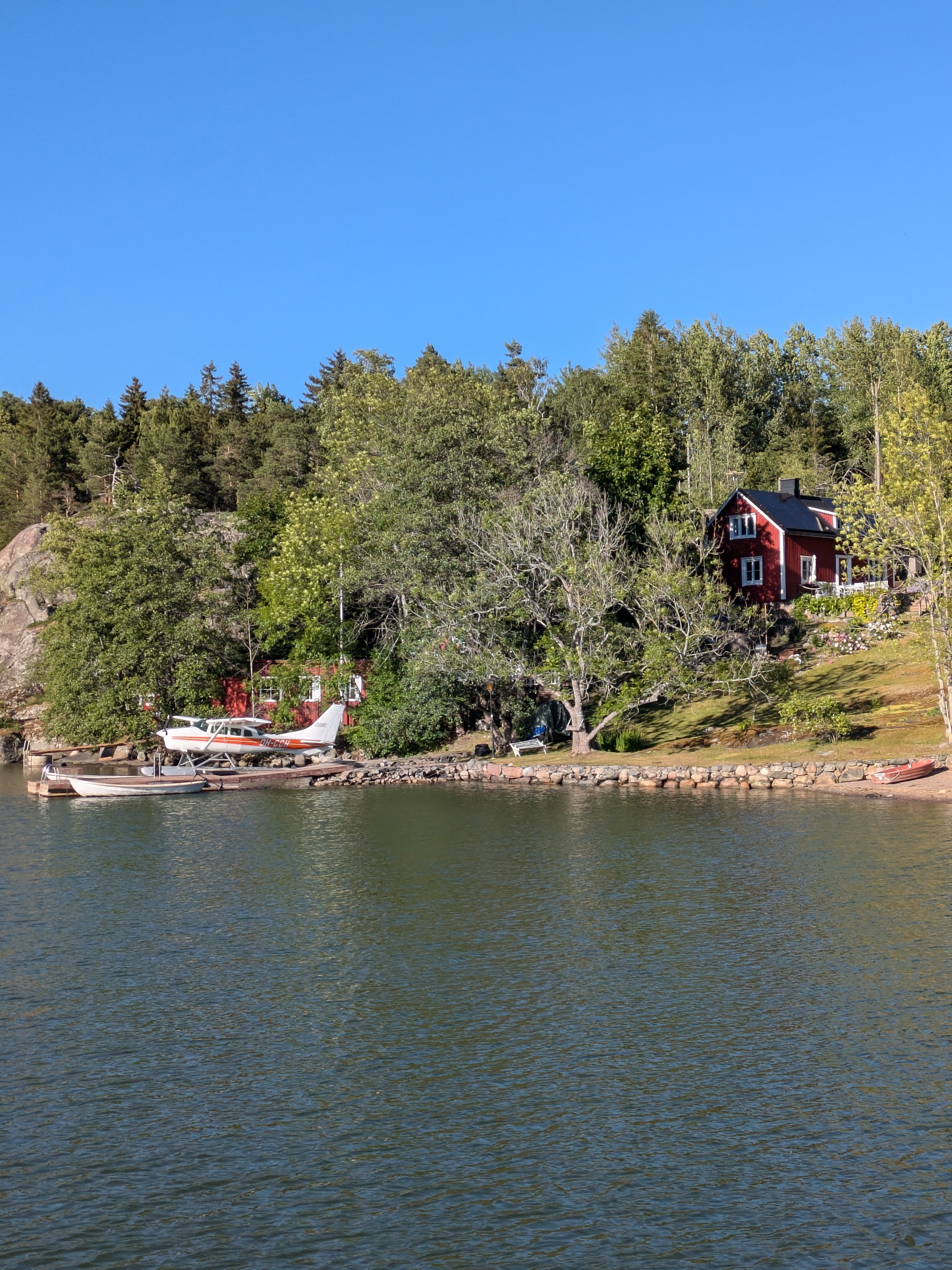 Red cabin by the lake in Finland, perfect for digital nomads