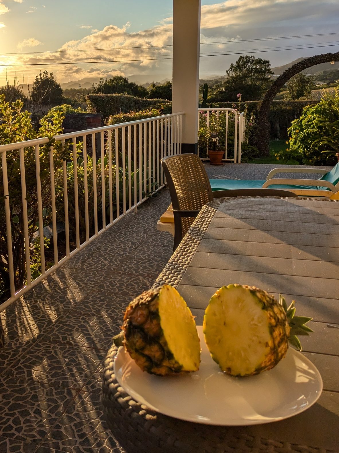 Azorean pineapple on a terrace at sunset, costing €10, a refreshing treat for digital nomads in the Azores.