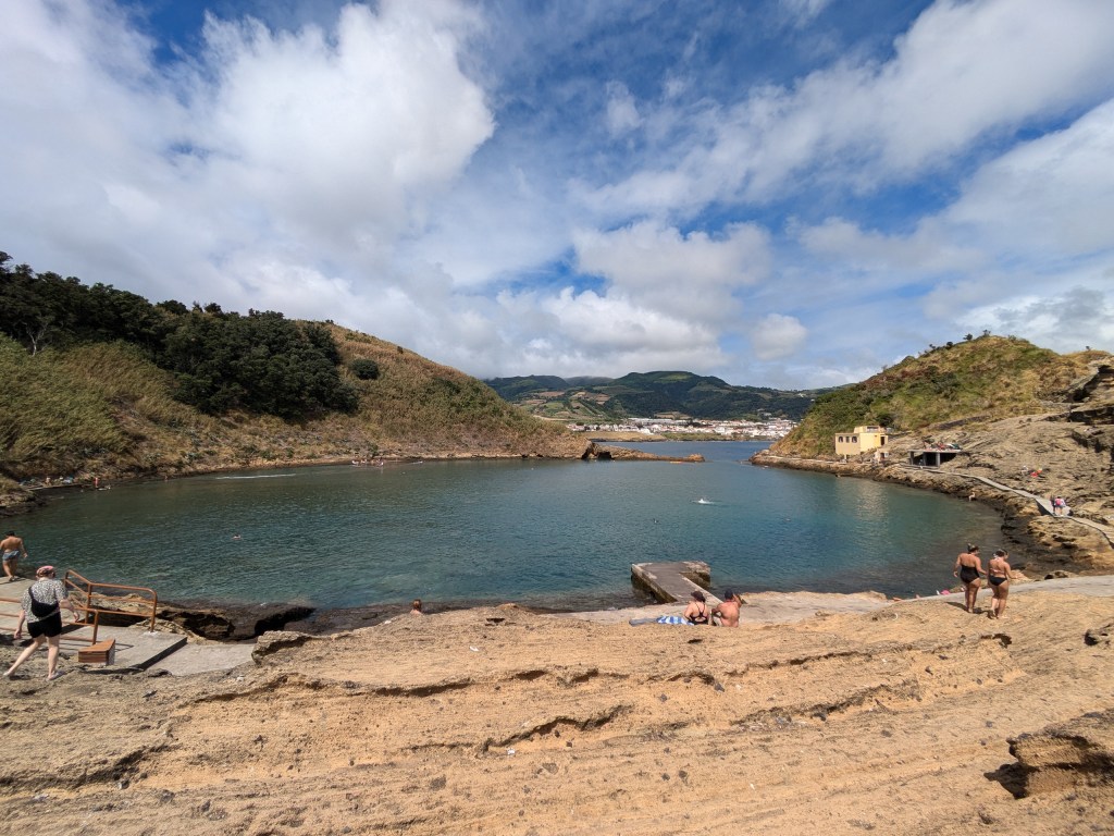 Natural thermal pool at Ferraria, a perfect spot for digital nomads in the Azores to relax by the ocean at low tide.
