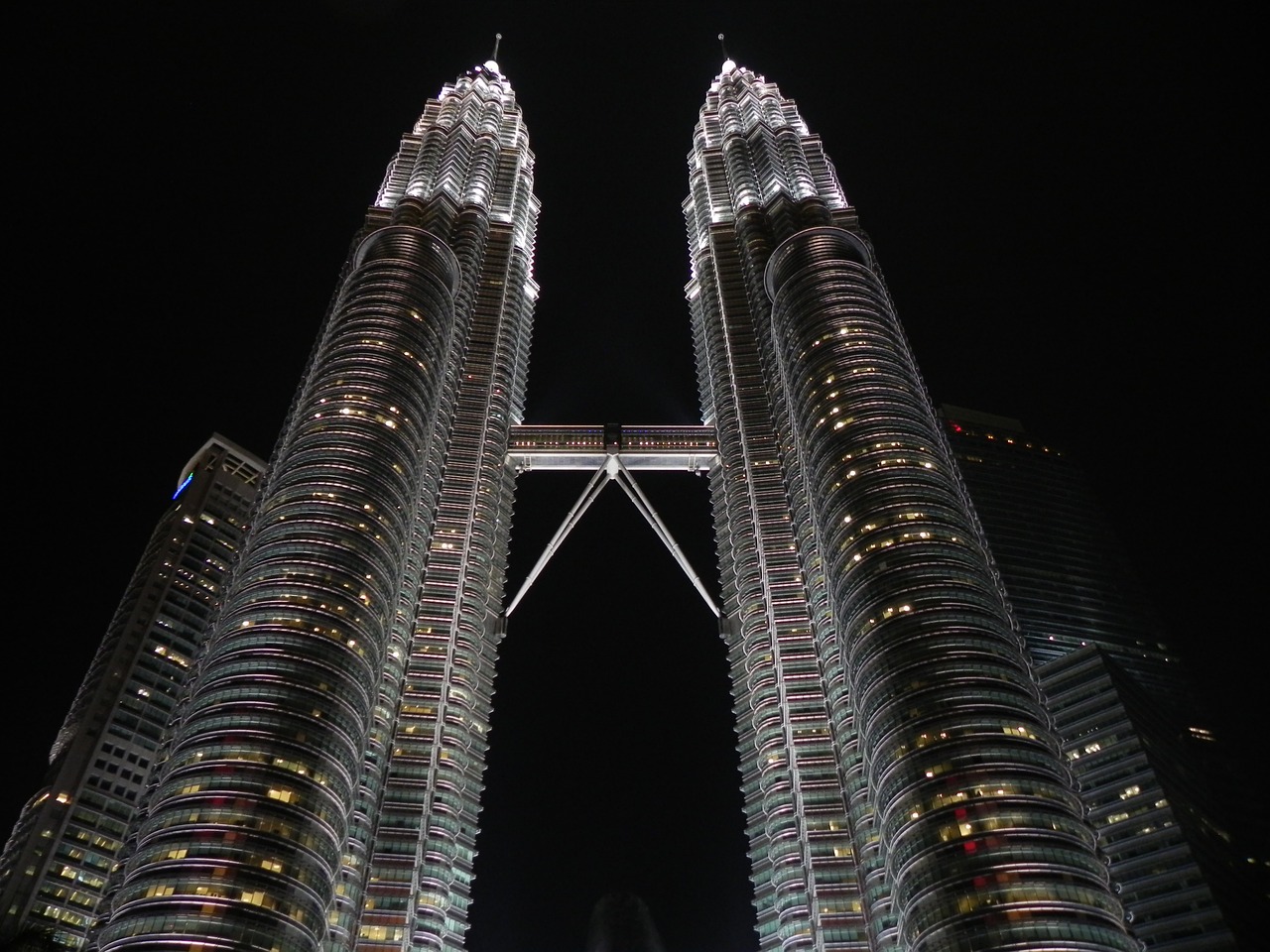 View of the Petronas Twin Towers at night, an iconic landmark in Kuala Lumpur for digital nomads in Malaysia