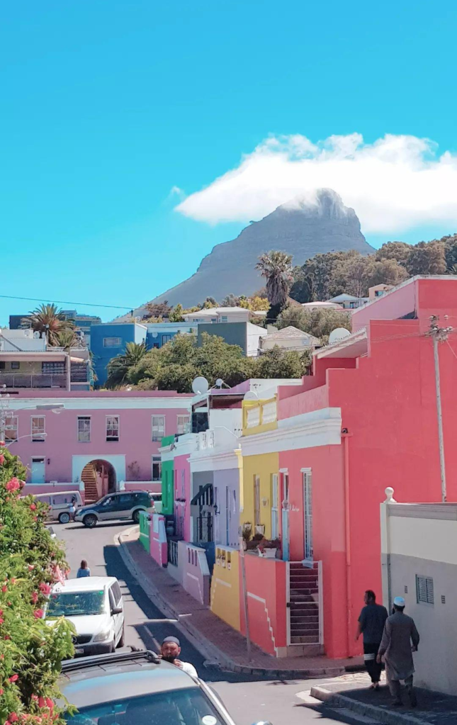 View of colorful houses in Bo-Kaap with Table Mountain in the background, a cultural highlight for digital nomads Cape Town