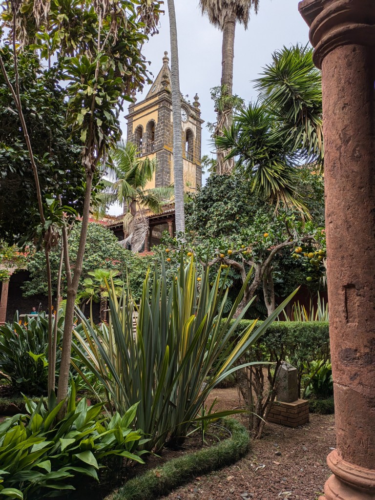 Digital nomad Tenerife Lush gardens and historic buildings in San Cristóbal de La Laguna, a UNESCO World Heritage Site.