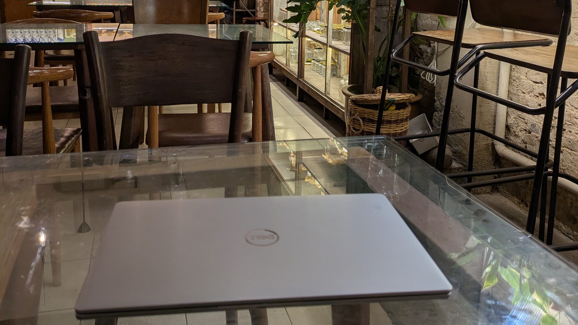 Laptop on a table at Mingle Café,  for digital nomads—best travel hack.