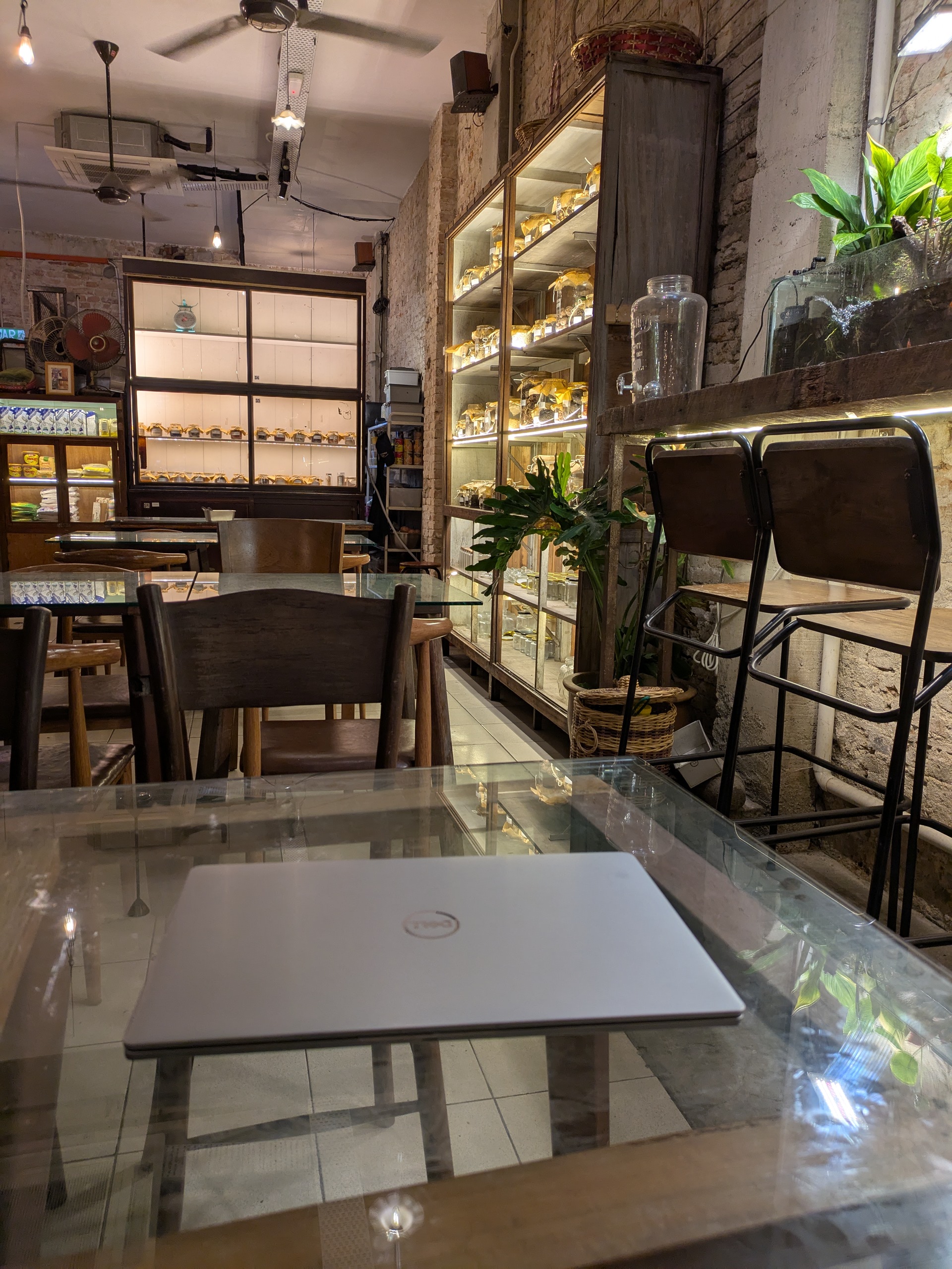 Laptop on a table at Mingle Café,  for digital nomads—best travel hack.