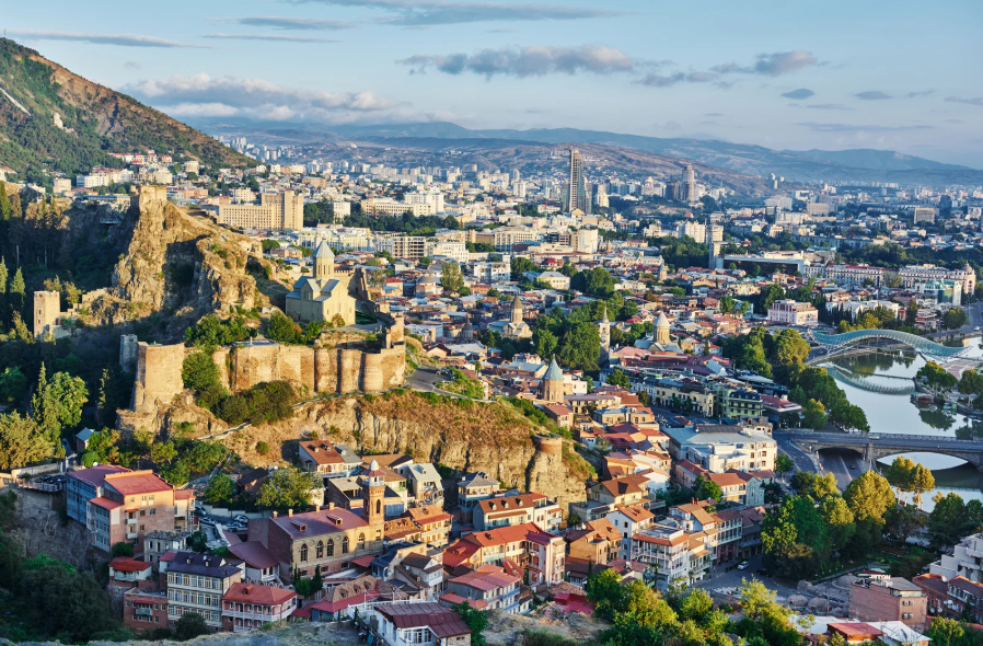 Panoramic view of Tbilisi, Georgia, featuring Narikala Fortress and the city skyline, in one of the countries with digital nomad visa.
