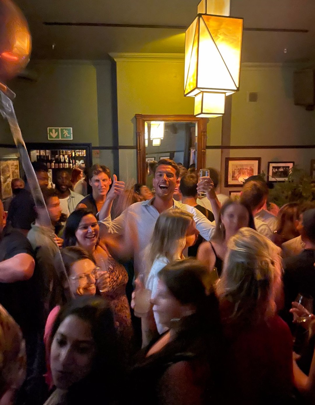 Social gathering at a lively bar, best travel hack for digital nomads.