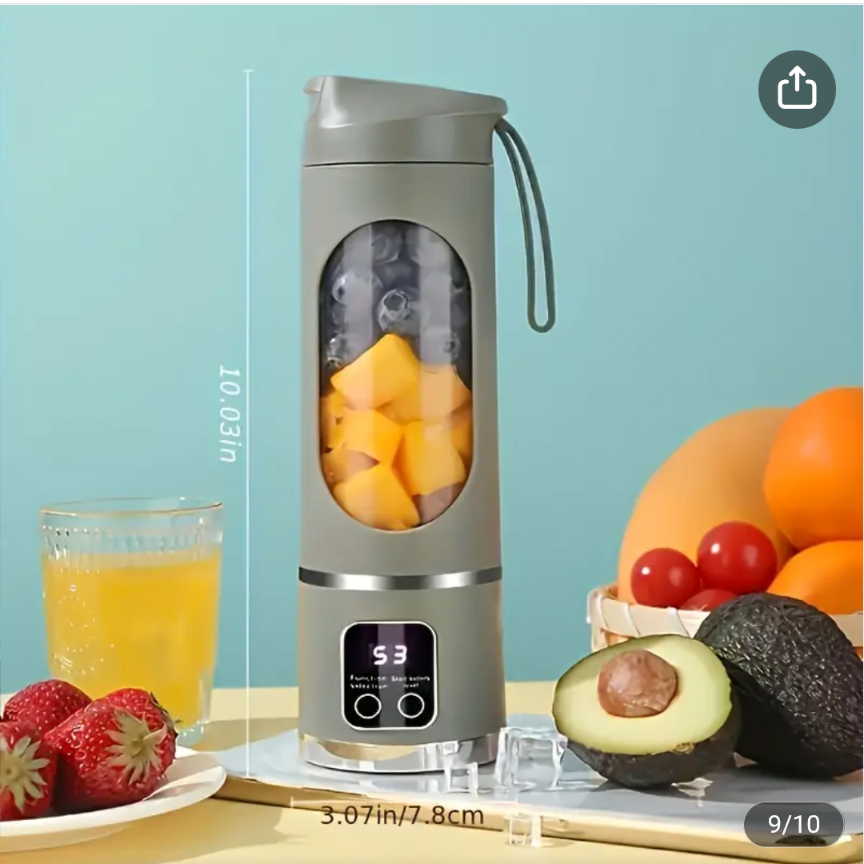 A portable USB blender with fresh fruits inside, displayed alongside a glass of juice and strawberries, set against a light blue background.